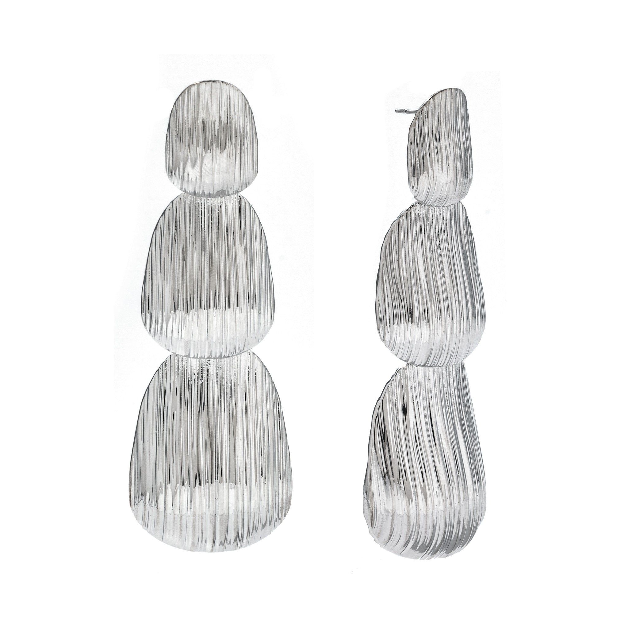 bold layered sculptural earrings with textured, light-catching surface.