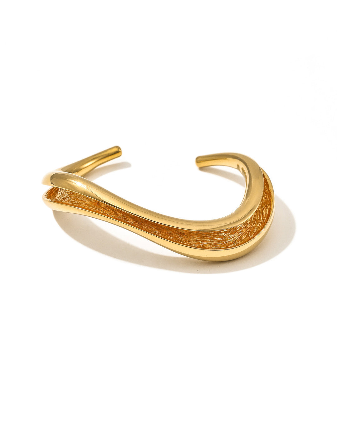 Currents Wave Cuff Bracelet smooth exterior with textured interior inspired by currents