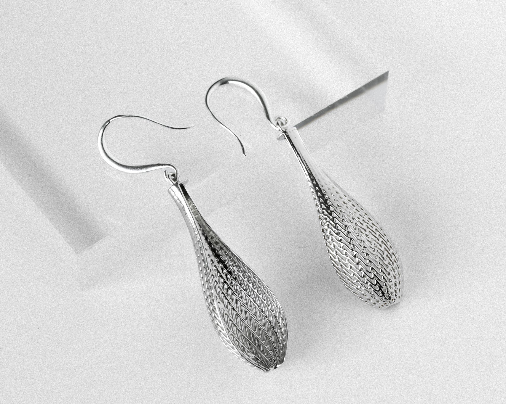 flow small tapered drop earrings with flowing lattice surface, silver-tone.