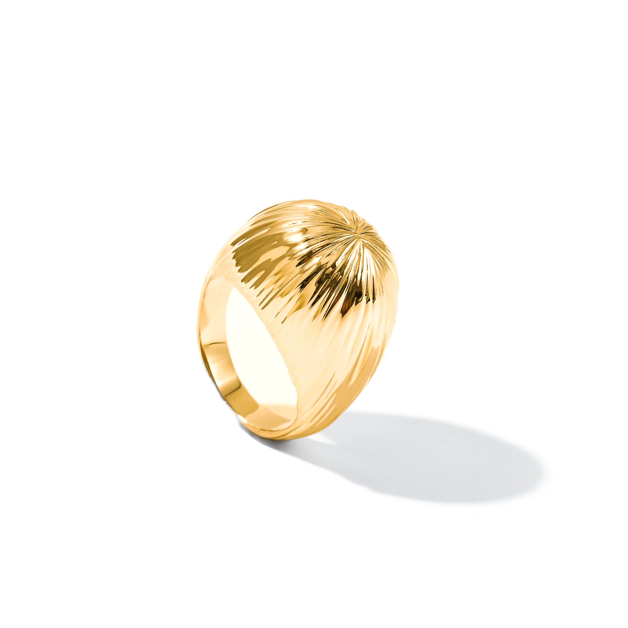 Gold Cascade dome statement ring with a cascading textured surface, on white