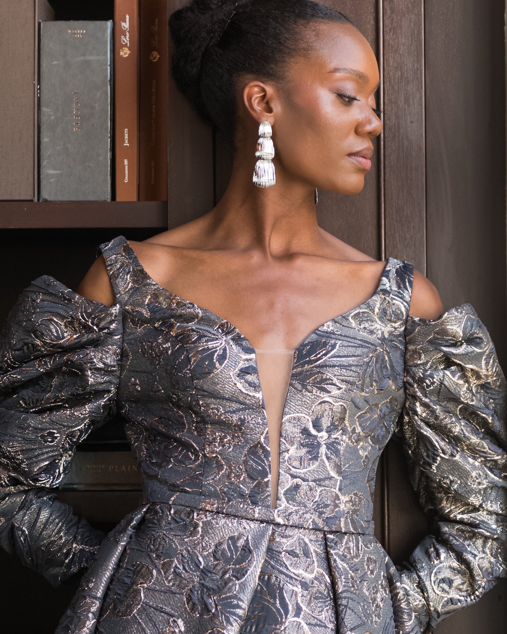Model wearing the Cascade layered earrings in gold