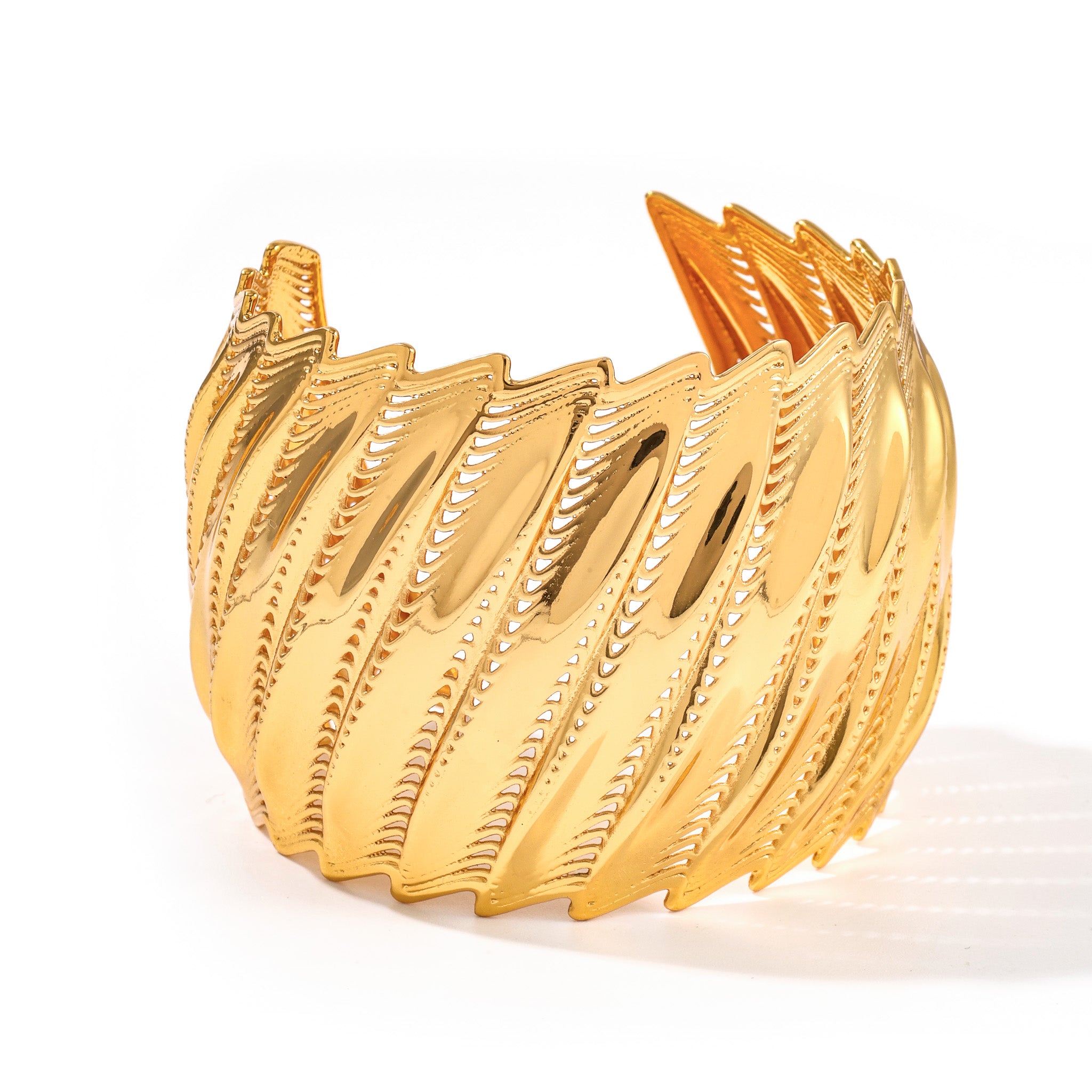 Gold Flow Edgy cuff bracelet with bold architectural ridged form, on white