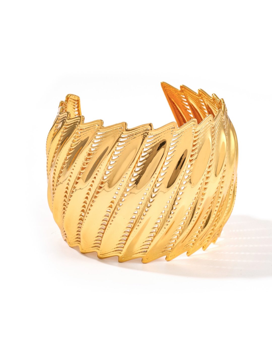 Gold Flow Edgy cuff bracelet with bold architectural ridged form, on white