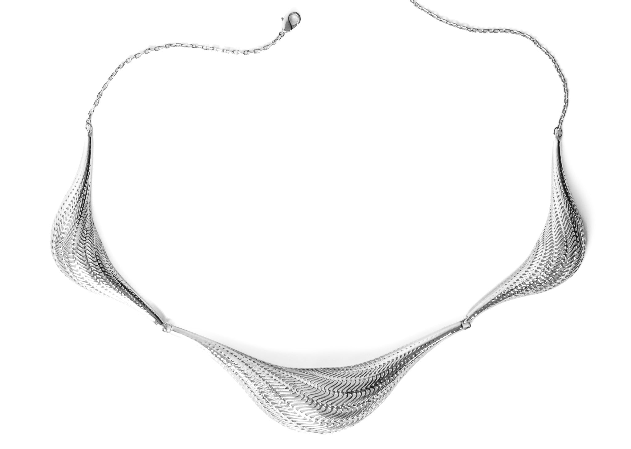 Angle view of the Flow Large necklace showing the flowing ridged form
