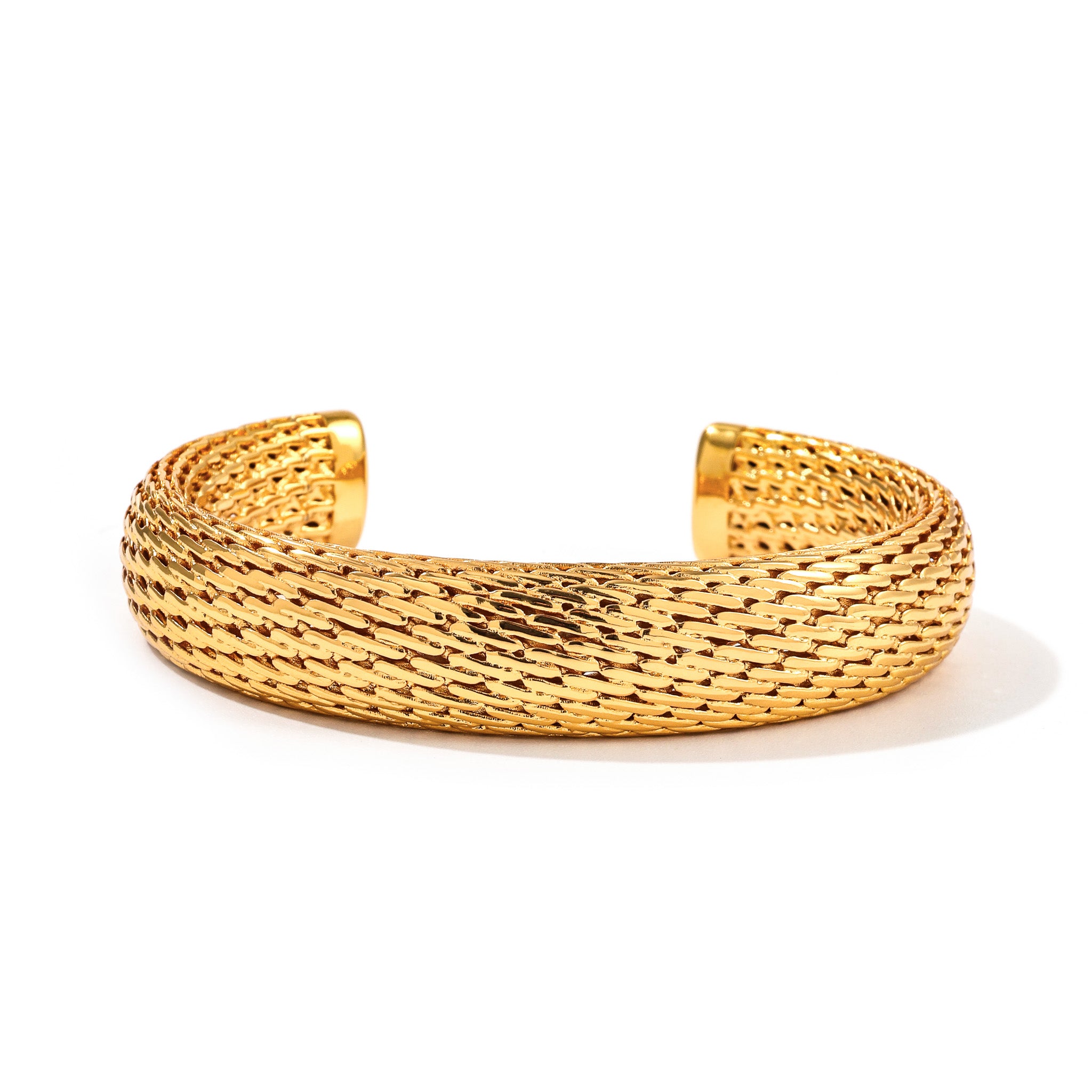 open cuff bracelet with woven flowing ridges, gold tone