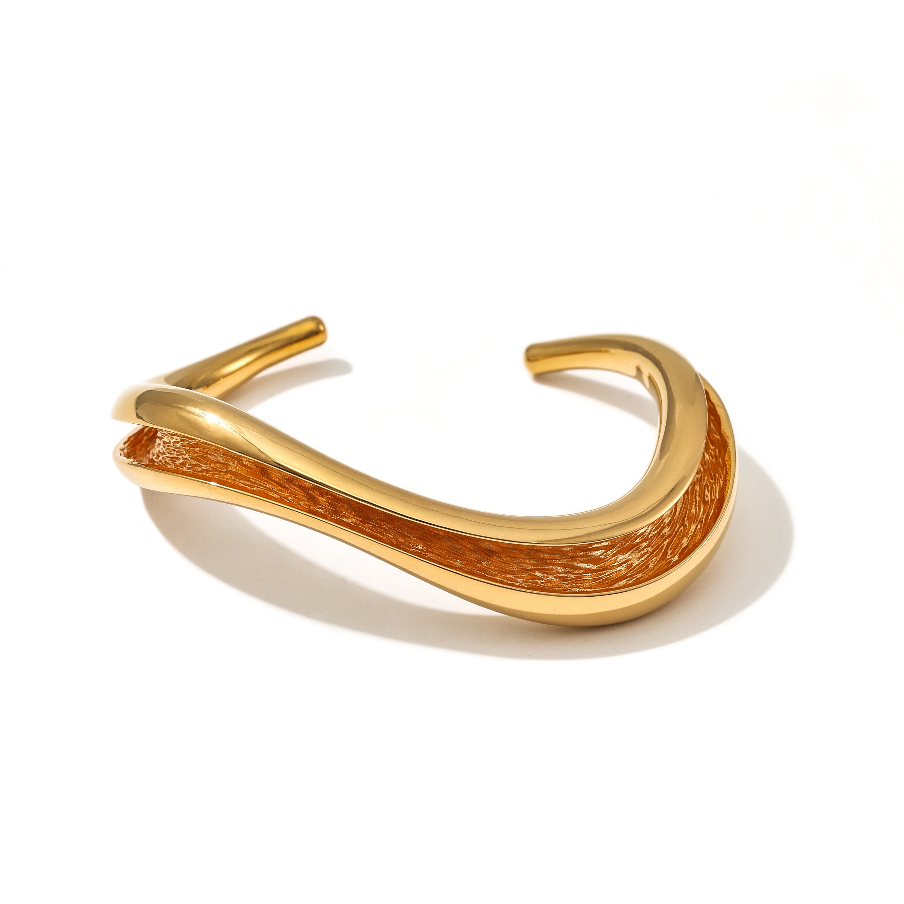 Currents Wave Cuff Bracelet smooth exterior with textured interior inspired by currents