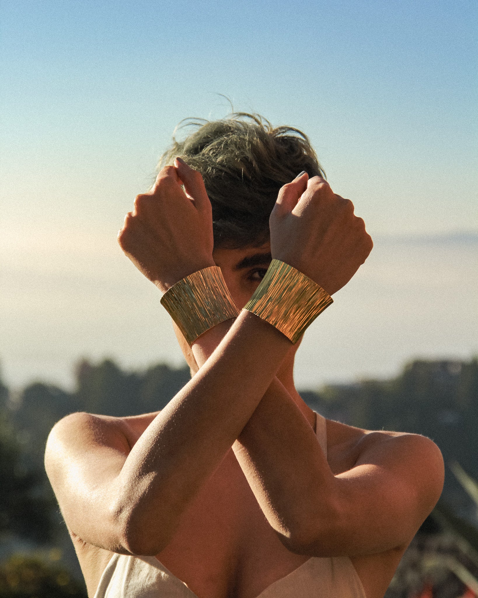 Model wearing the silver Cascade cuff bracelet on the wrist