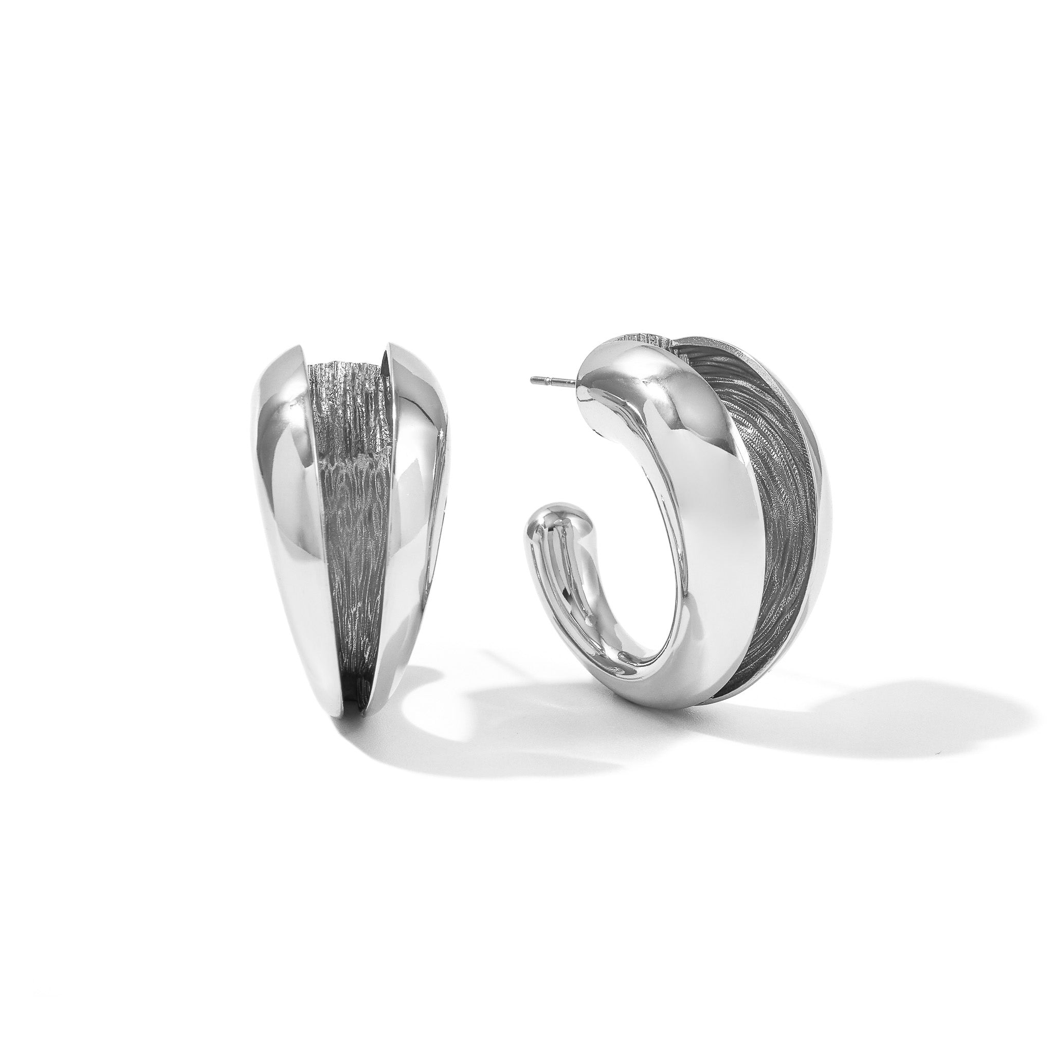 Angled view of the gold Currents hoop earrings showing the 30mm rounded form