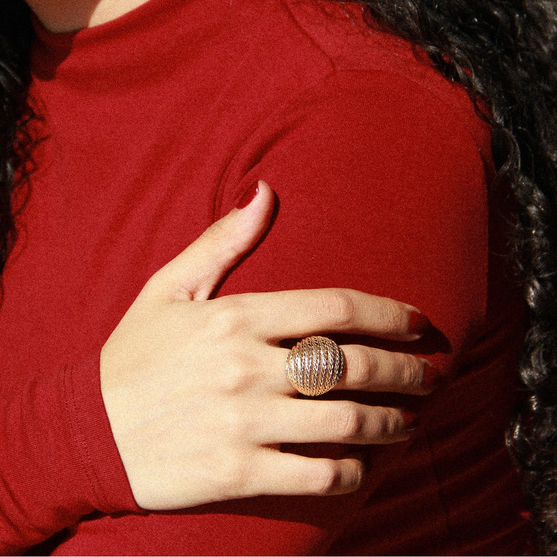 Model wearing the gold Flow Ball Ring